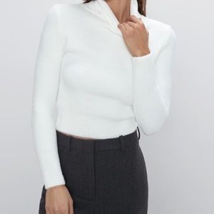 White cropped turtleneck sweater